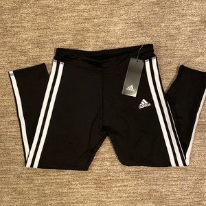 NWT Girls Adidas cropped leggings. Black with white stripes. New Girls size M.